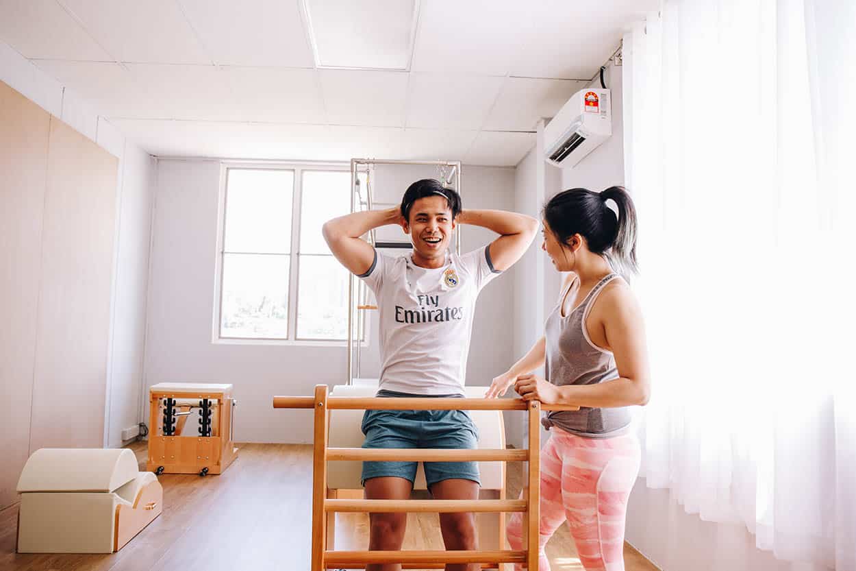 A private 1-on-1 Clinical Pilates session, working on lower back mobility and stability at Body in Common