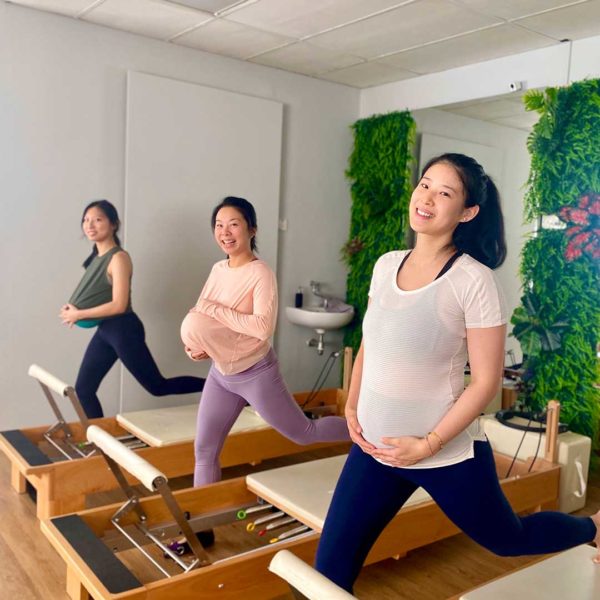 A client does pre-natal pilates with the instructors.
